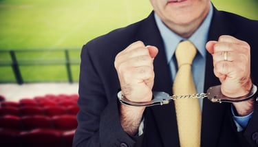 Businessman with handcuffed hands